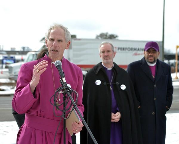 Western Massachusetts Episcopal Bishop Douglas Fisher speaks at a rally of high school students calling for greater gun safety outside Smith and Wesson headquarters on March 14, 2018.