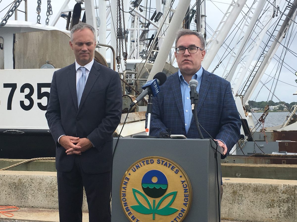 Environmental Protection Agency Acting Administrator Andrew Wheeler (right) talks during an EPA event in New Bedford Wednesday. There, he told a reporter that he believes humans are contributing to climate change.