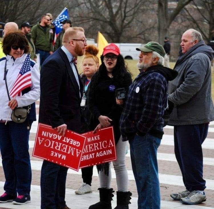 A photo circulating on Facebook shows Earnheart holding a pro-Trump sign. Earnheart won a state Democratic Party endorsement over Rep. Moira Walsh.