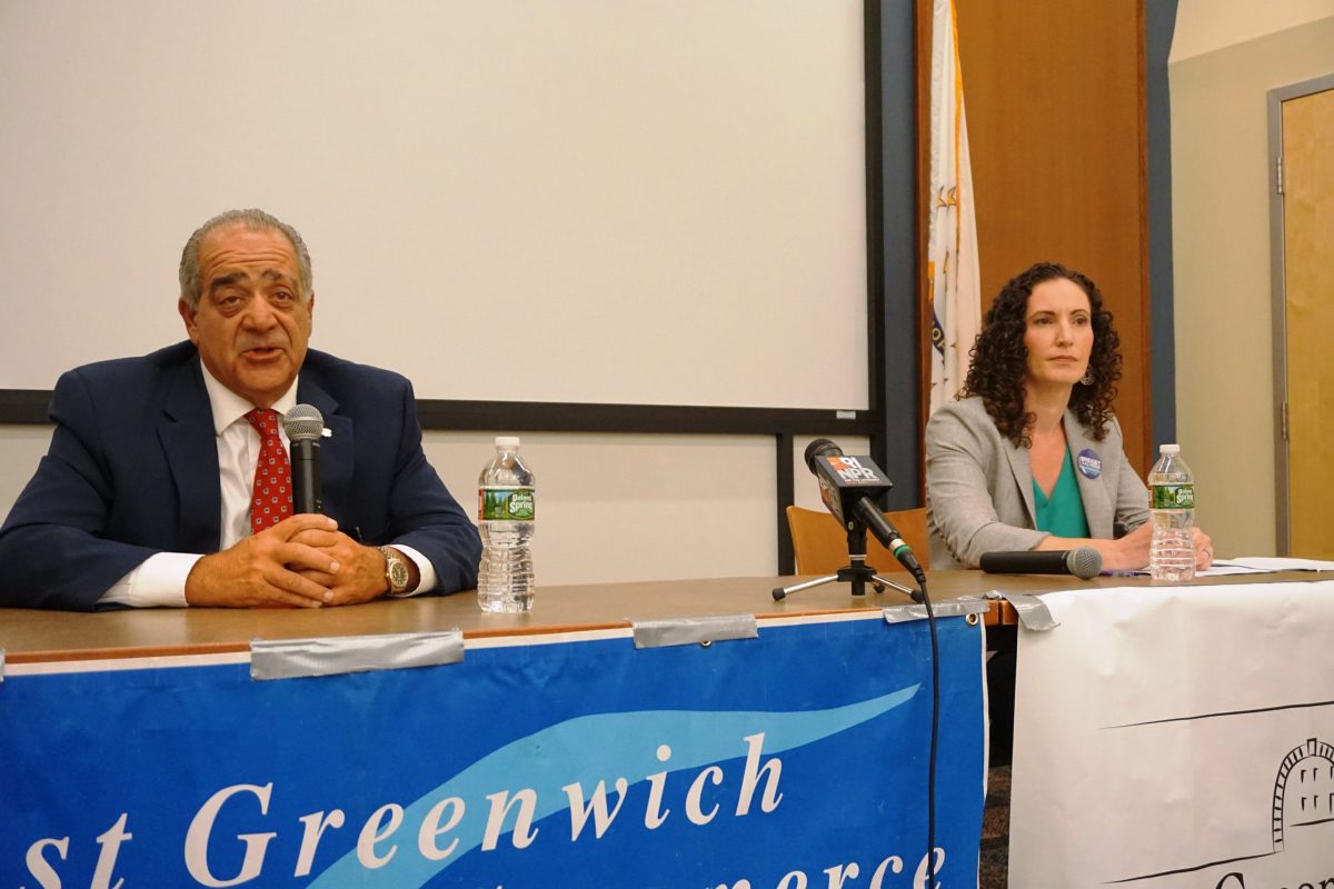 Greg Acciardo and Bridget Valverde at a candidate forum in East Greenwich, where the divide between established Democrats and progressive newcomers is playing out.