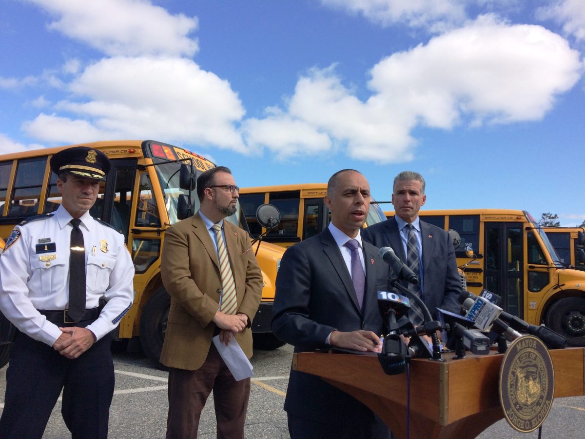 Providence Mayor Jorge Elorza, center, speaks at the Providence Bus Depot Friday afternoon.