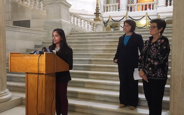 Mohanty (left), joined by Goldin and DeBare, speaks during a Statehouse news conference.