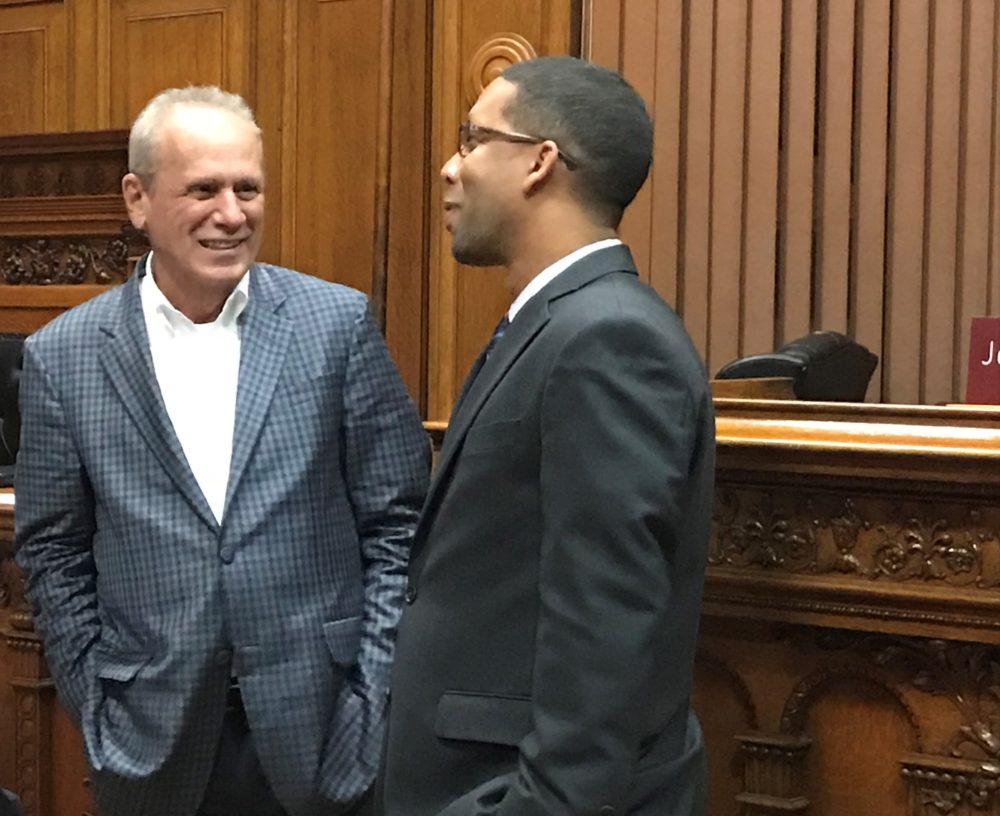 Larry Lucchino, left, co-owner of the Red Sox's top farm team, grinned after Sean Rose and the Worcester City Council approved a stadium financing plan for the baseball club.