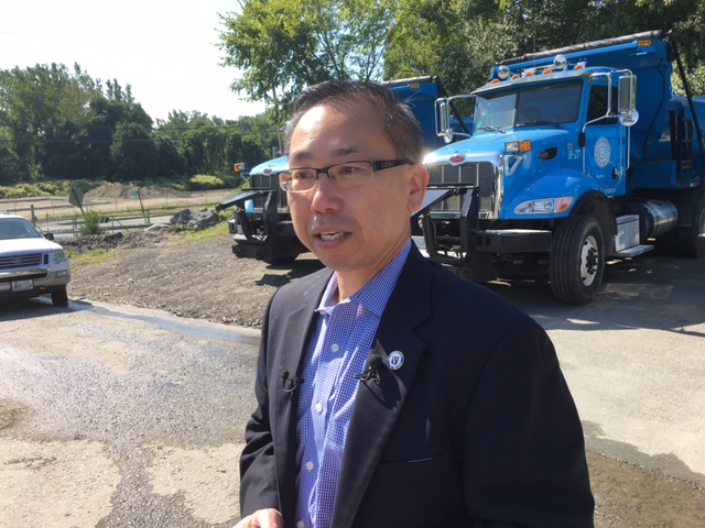 Fung speaking with reporters in 2017.