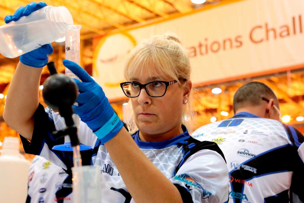 Kim Sandbach from the Narragansett Bay Commission checks the pH and alkalinity of a water sample during the "Wastewater Olympics."