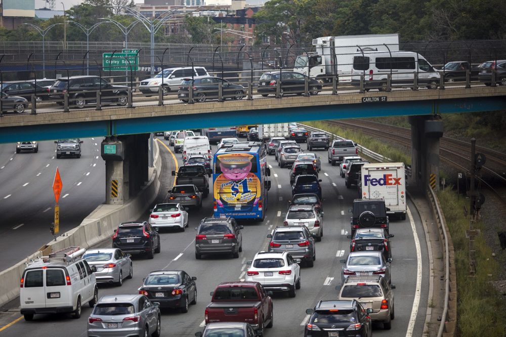 The Friday evening commute begins as cars jam up on the Mass. Pike and on the overpass on Carlton Street in Brookline.