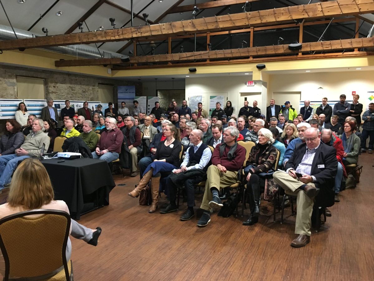 A crowd of more than 50 people listen during a presentation at a public hearing in new Bedford on a draft environmental impact statement for Vineyard Wind's proposed project.