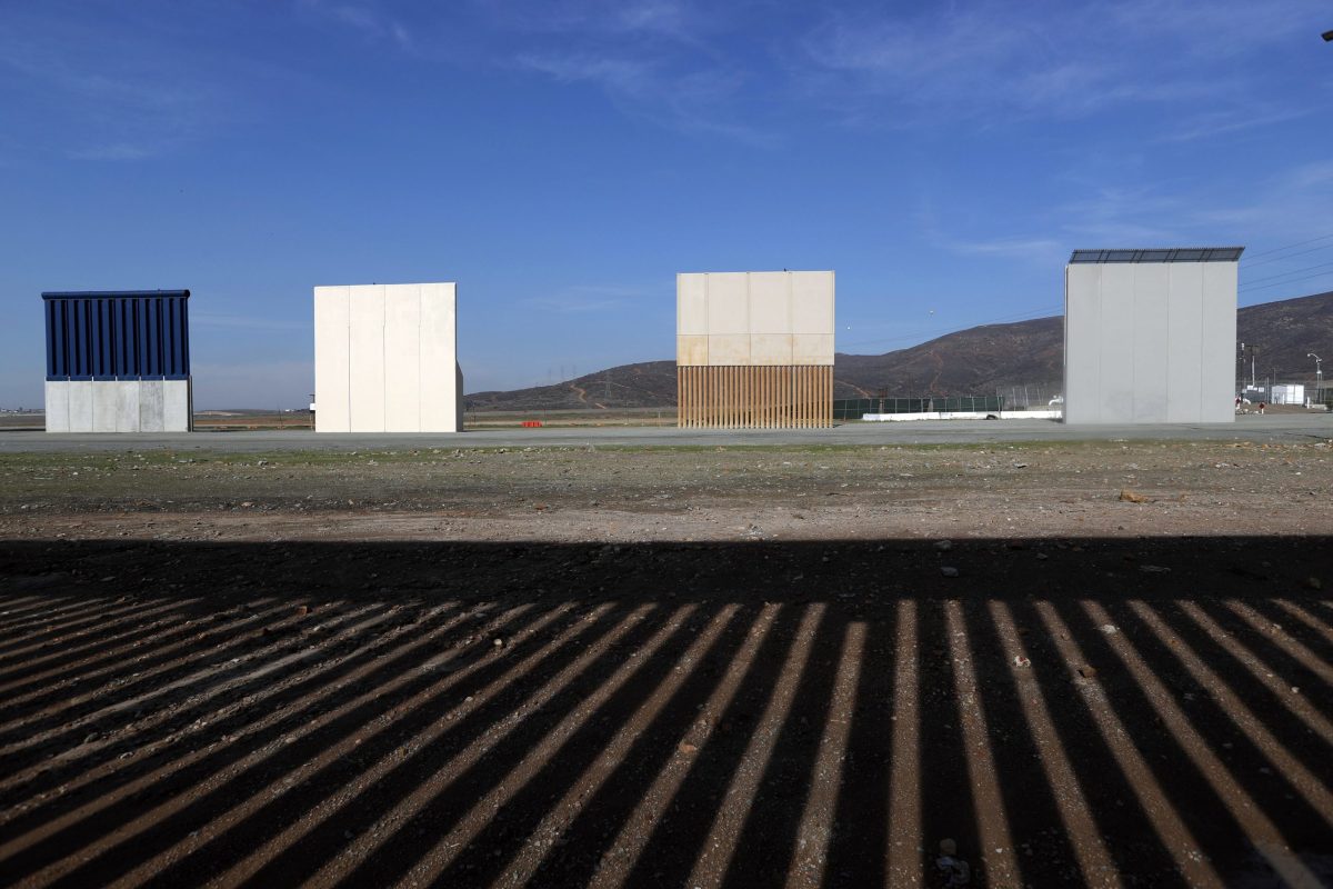 In this Wednesday, Dec. 12, 2018, file photo, border wall prototypes stand in San Diego near the Mexico-U.S. border, seen from Tijuana, Mexico, where the current wall casts a shadow in the foreground. Customs and Border Protection said Friday, Feb. 22, 2019, President Trump’s eight border-wall prototypes will be torn down to make way for a secondary barrier separating California from Mexico.