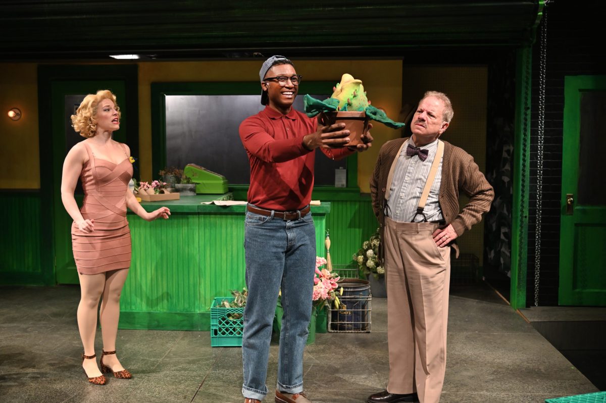 Rebecca Gibel (left) as Audrey, Jude Sandy as Seymour, and Stephen Berenson as Mr. Mushnik in Trinity Rep's production of "Little Shop of Horrors." Puppets by Monkey Boy Productions.