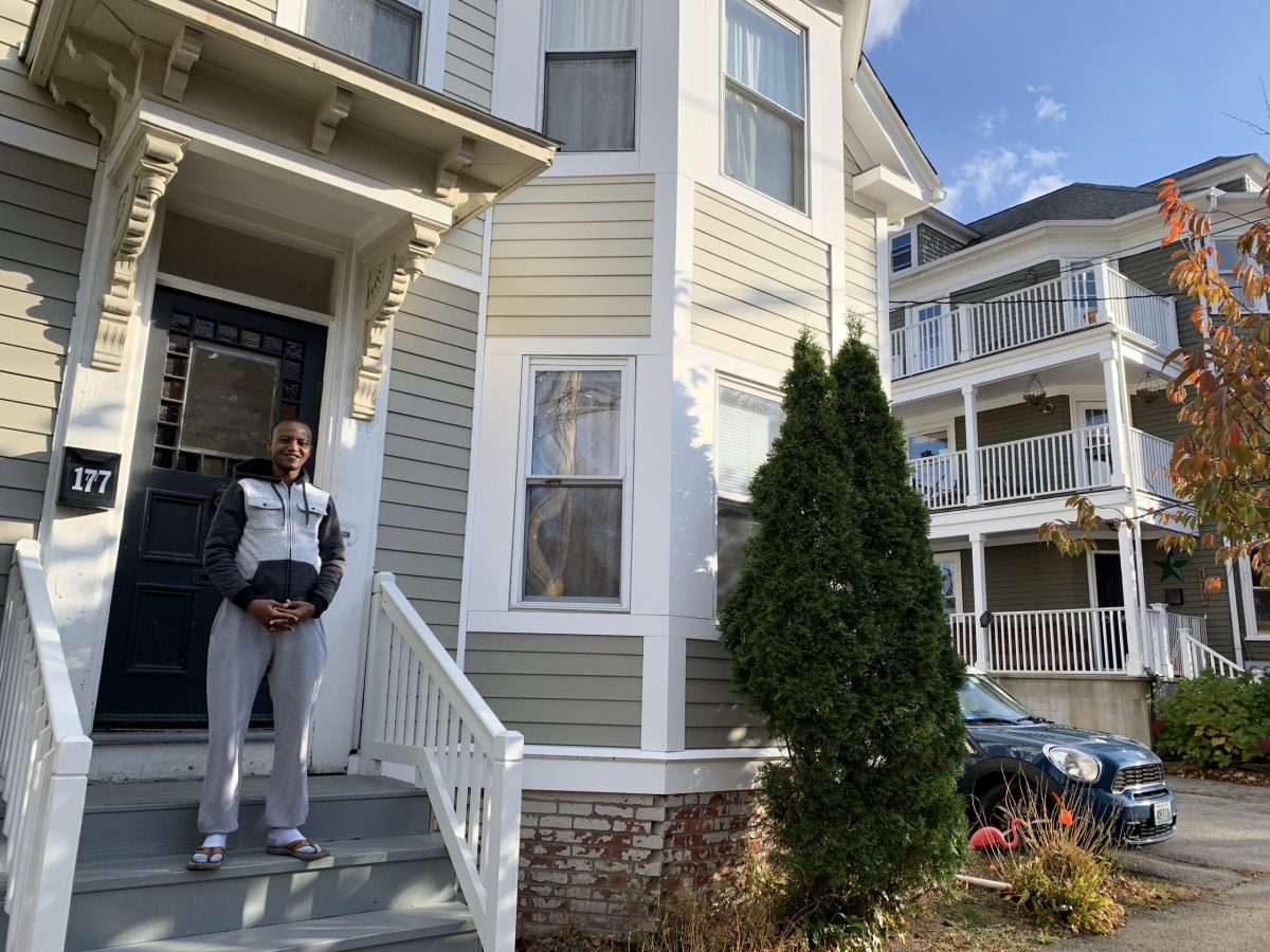 Alphonse Mupenzi outside of his home in Providence