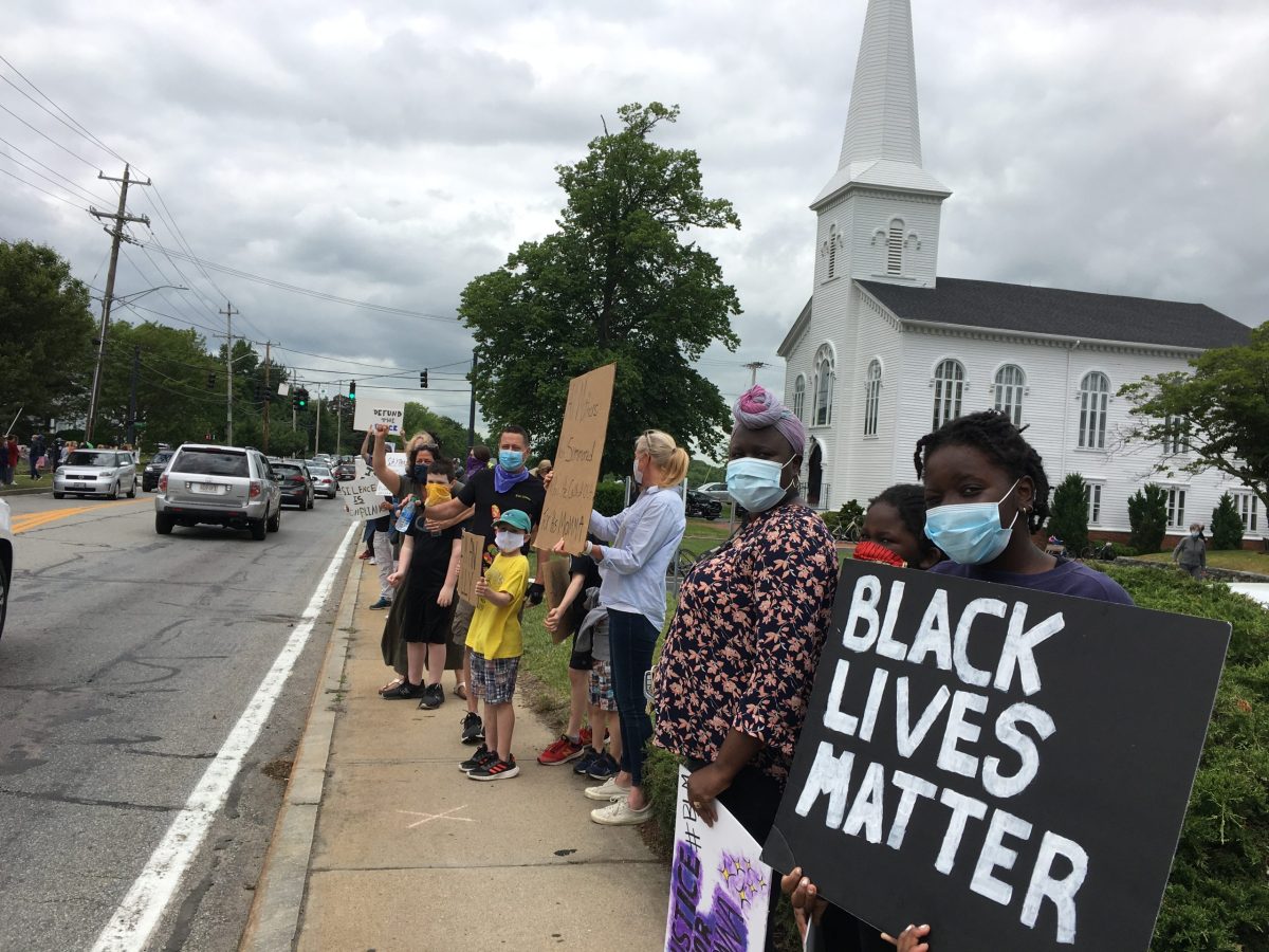 Protesters lined County Road in Barrington, R.I. on Sunday.