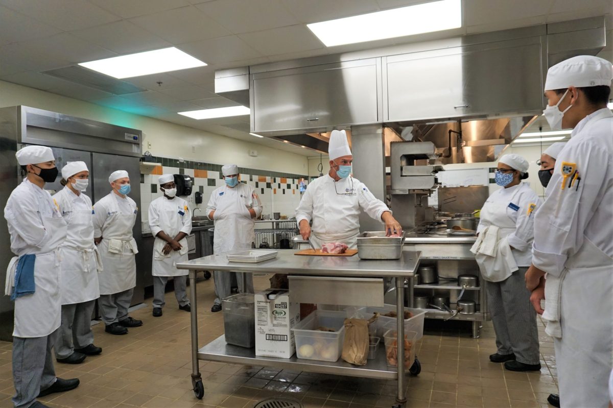 Chef John Dion demonstrates for students taking in-person courses on campus at Johnson and Wales this summer.