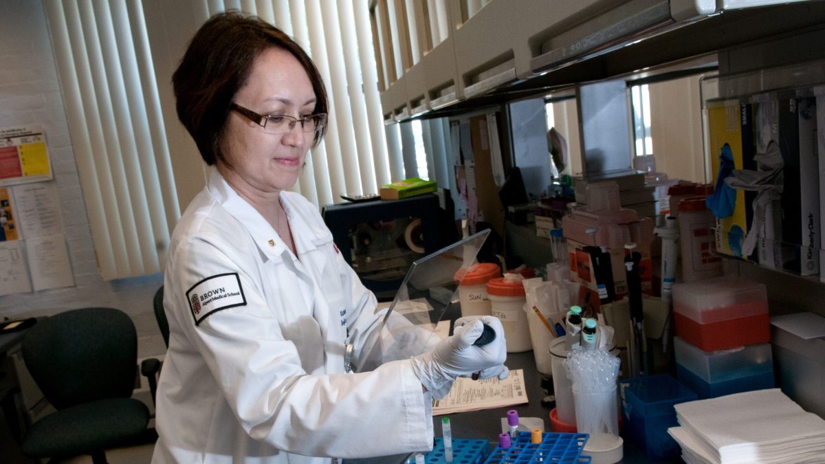Dr. Karen Tashima, director of clinical trials at The Immunology Center at The Miriam Hospital, in Providence, RI, at work in her lab.