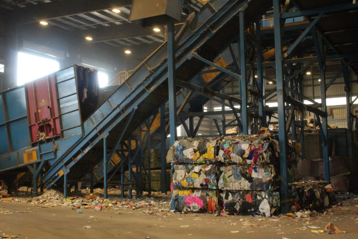 Bales of plastic sit on the floor of a materials recovery facility in Rochester, Mass.