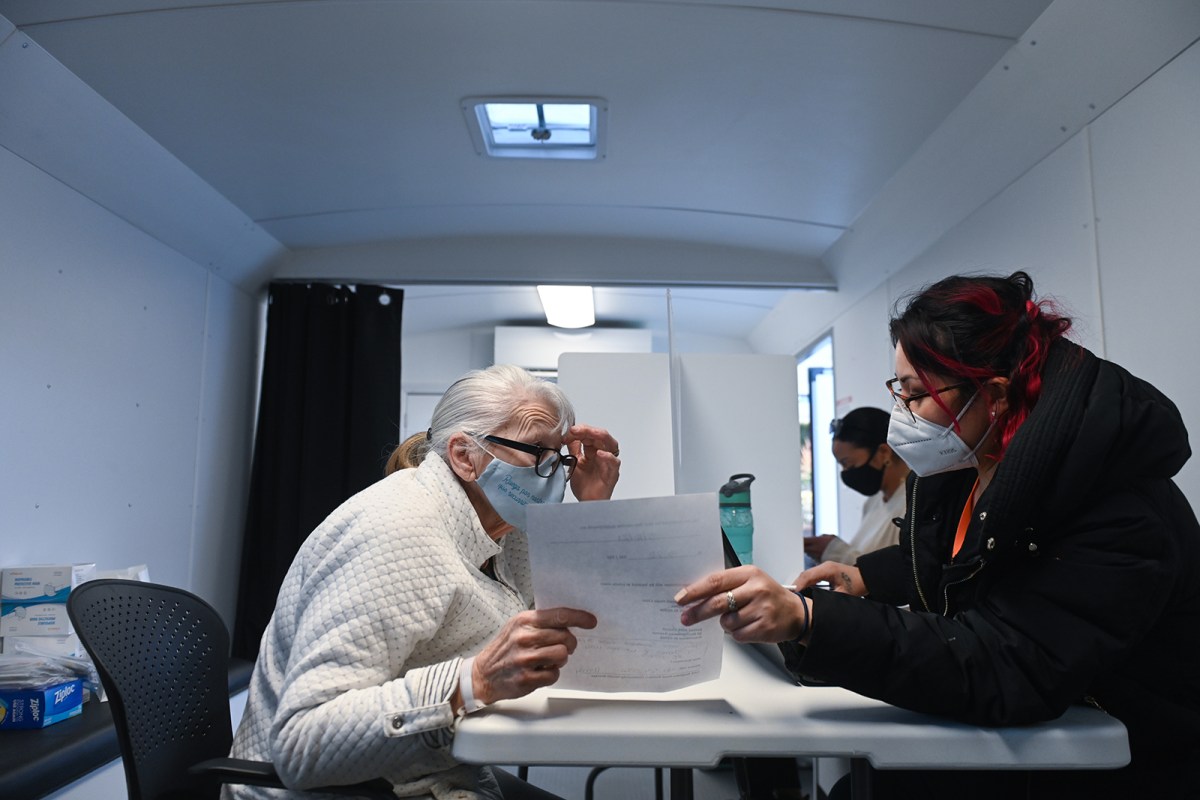 Providence nonprofit Neighborhood One Builders registers residents for vaccines in a mobile trailer