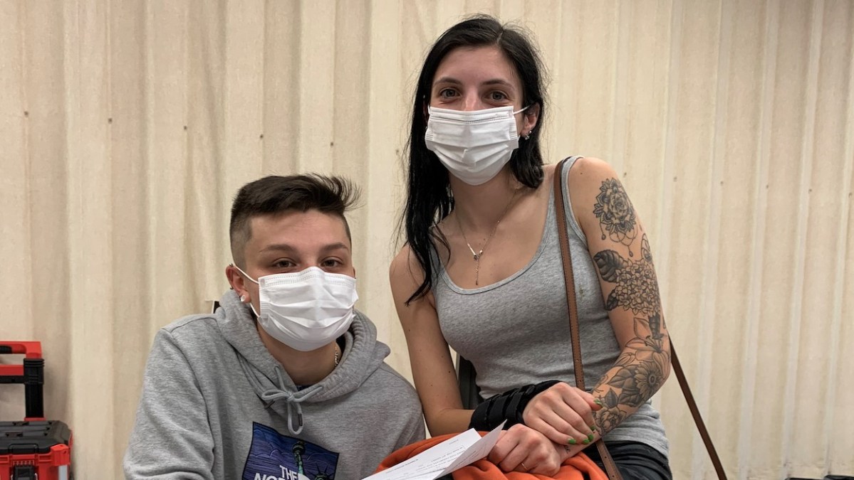 Emma Landroche, 22, of Warwick, a nursing assistant, and her partner, Alyssa Sartini, 25, who works in retail, waiting to be vaccinated Sept. 30 at the Pilgrim Senior Center in Warwick.