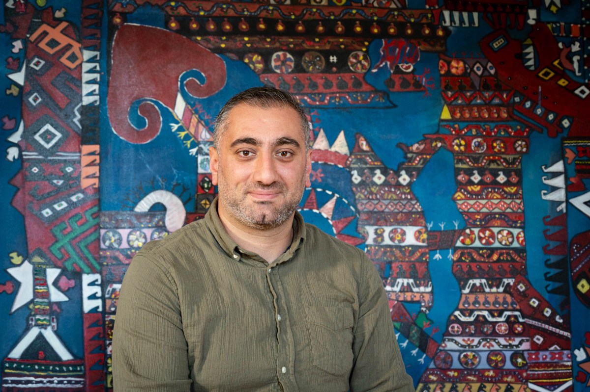 Selahattin Sep in front of one of his works of art.