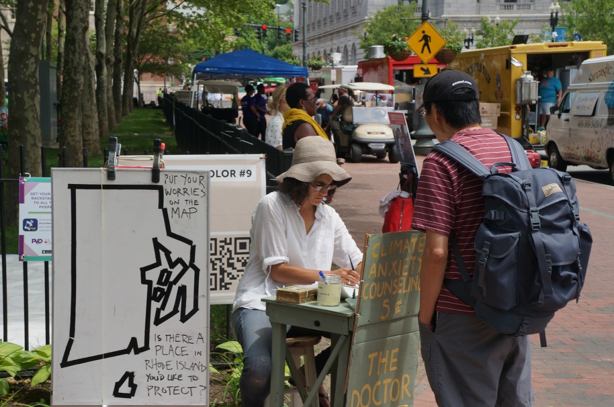 Kate Schapira at the Climate Anxiety Counseling booth in Kennedy Plaza