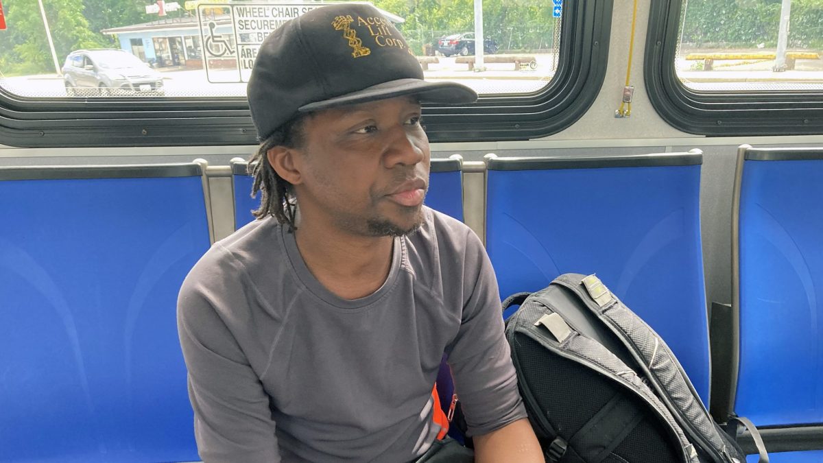 Mack Blackie rides a bus to the DMV to get a new ID card.