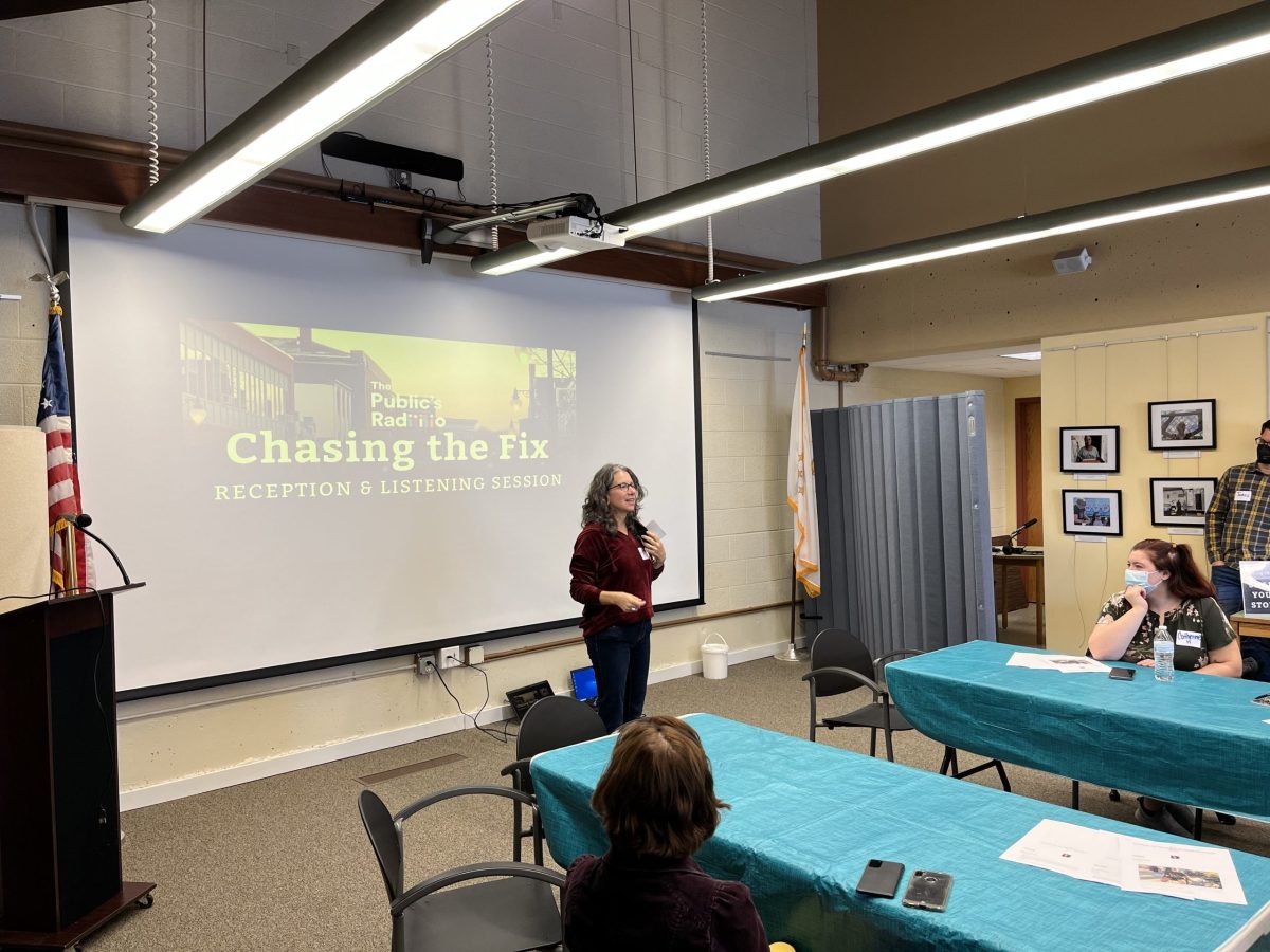 Reporter Lynn Arditi speaks at a listening session at the Woonsocket Harris Public Library in February 2023.