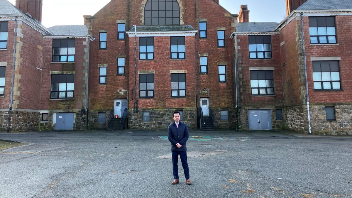 Newport Mayor Xay Khamsyvoravong stands at the back of Coggeshall School on Van Zandt Avenue. The school has been vacant since its doors in June 2013.