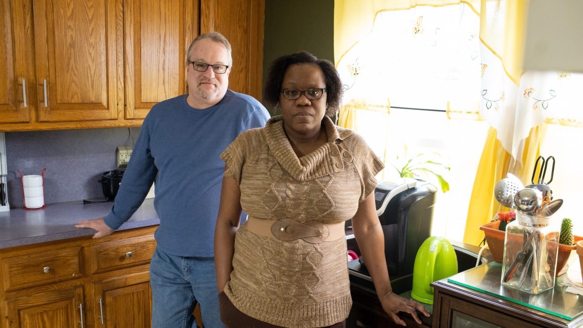 Sabrina and Jonathan Harlan look over their current property tax bill inside their house in Woonsocket, RI.