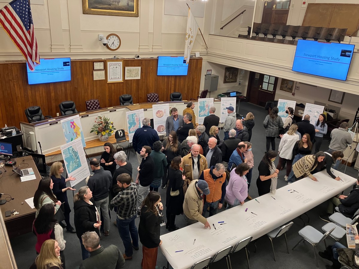 At an open house meeting at Newport City Hall, attendees view findings from a new study on the city’s housing stock on Thursday night, Feb. 22, 2024. They had the opportunity to discuss the data with the consultants who produced the study and leave their comments.