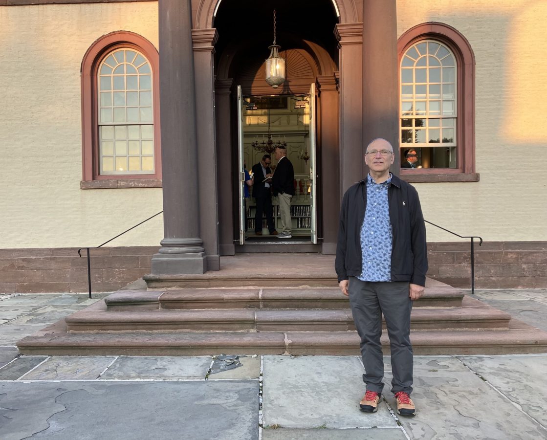 Aaron Ginsburg poses for a portrait in front of Touro Synagogue before Shabbat service in Newport, Rhode Island, on Friday, September 1, 2023, in Newport, RI.