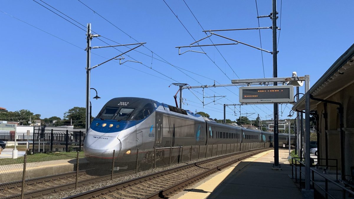 An Amtrak train passes through the Westerly train station.