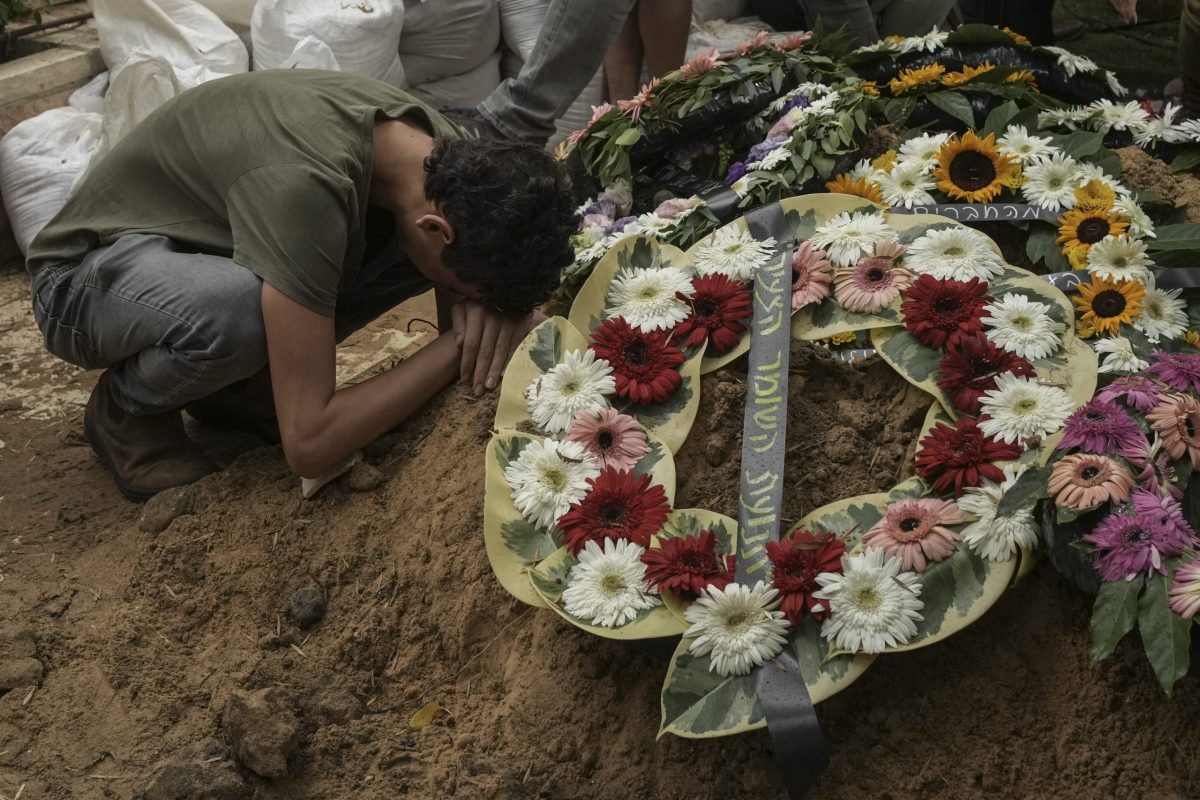 A man mourns during the funeral of Israeli Col. Roi Levy at the Mount Herzl cemetery in Jerusalem on Monday, Oct. 9, 2023. Col. Levy was killed after Hamas militants stormed from the blockaded Gaza Strip into nearby Israeli towns.