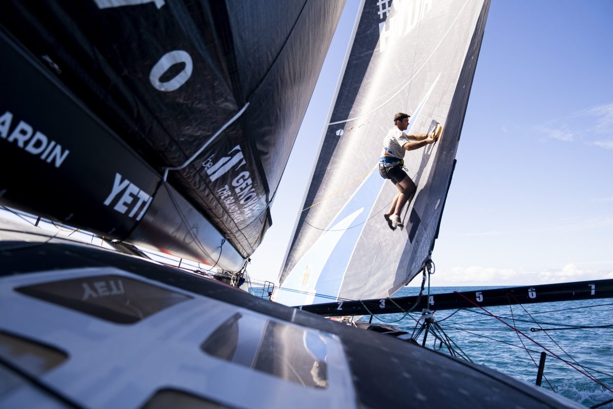 Skipper Charlie Enright fixes a small tear in the J2 while it's high and dry, on Wednesday, April 26, 2023, during the 11th Hour Racing Team's Leg 4 in The Ocean Race.