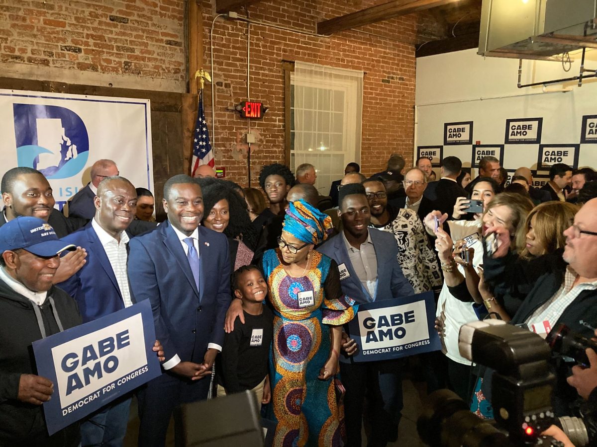 Democrat Gabe Amo, pictured with family at his victory celebration at The Guild in Pawtucket, scored a victory early in the night over Republican candidate Gerry Leonard.