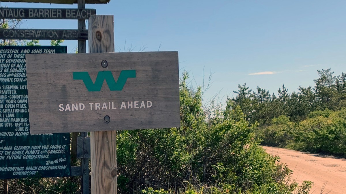 A sign for the Sand Trail posted at the entrance of Quonochontaug Barrier Beach in the Weekapaug section of Westerly.