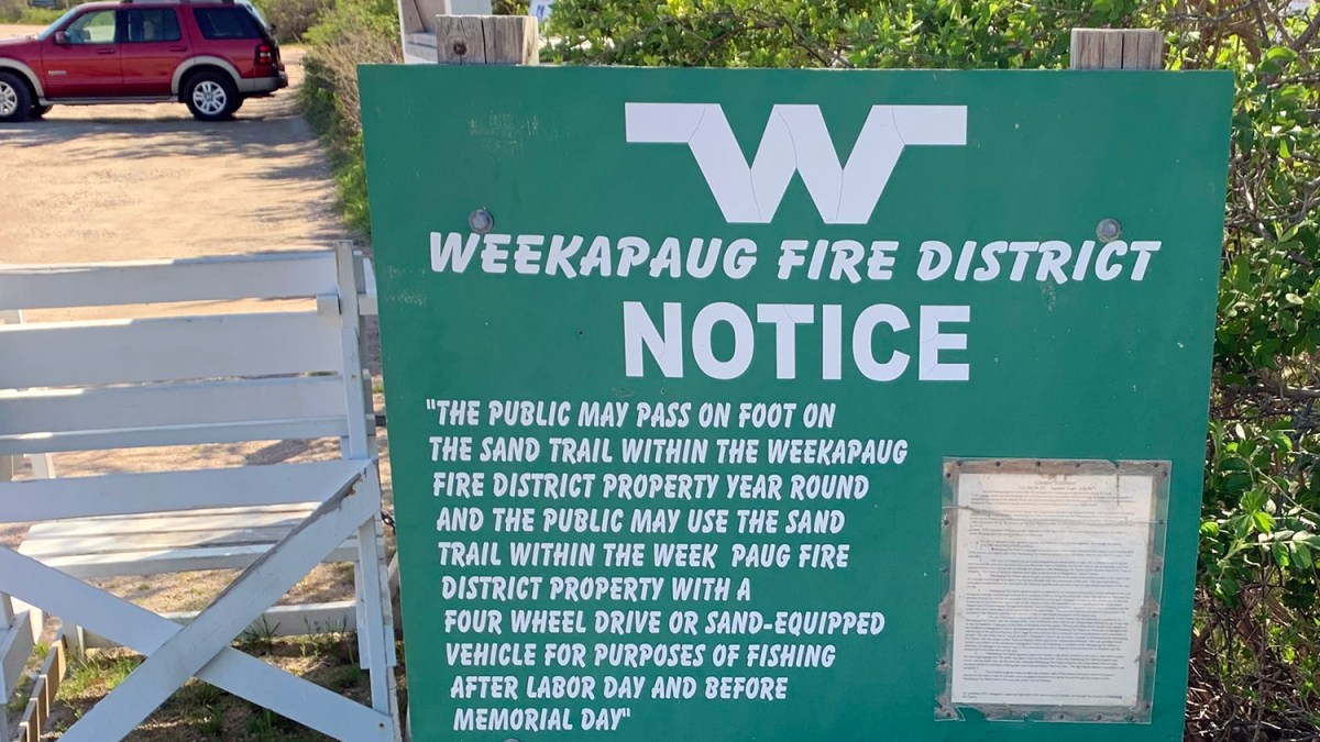 A sign describing rules under the 1997 consent judgment between the town of Westerly and Weekapaug Fire District governing use of the Quonochontaug Barrier Beach.