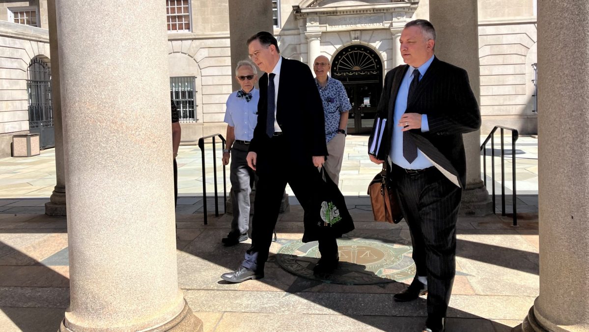 Louis Solomon, left, leaves Rhode Island Superior Court on Thursday, Sept. 14, 2023. Solomon is the president of Congregation Shearith Israel in New York. The congregation's lawyer, Mitch Edwards, right, spoke before the judge about lifting a stay of eviction the judge granted to the local congregation at Touro Synagogue in Newport.