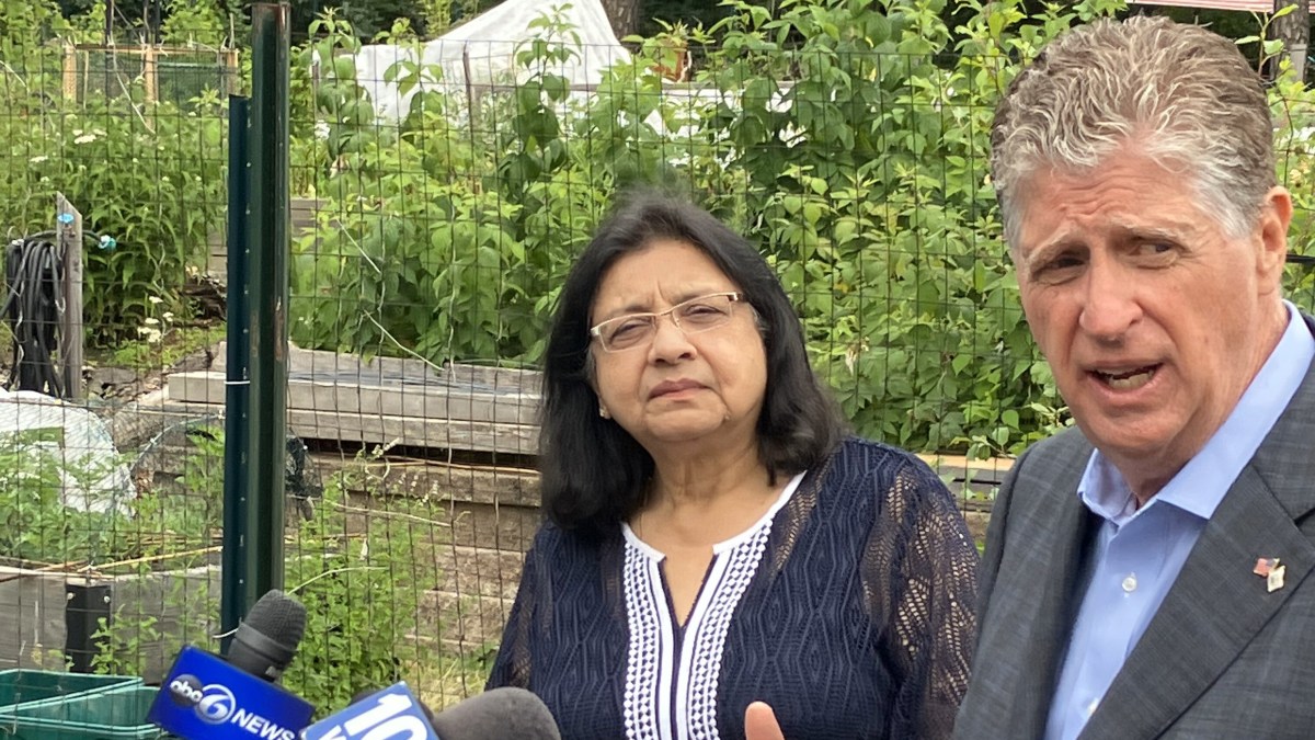 Dr. Uptala Bandy, interim Rhode Island health director, and Gov. Daniel J. McKee at a press conference