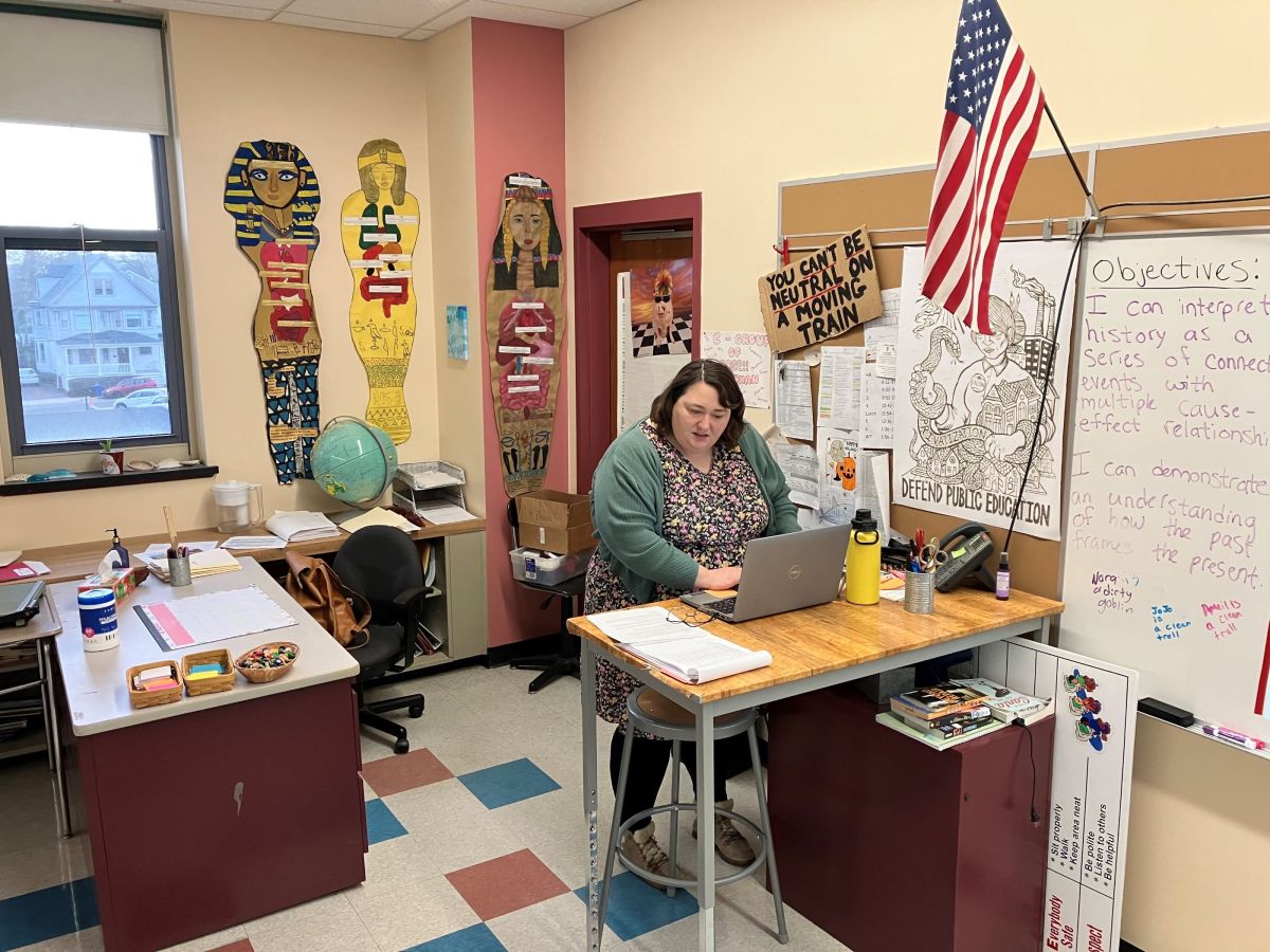 Eighth-grade social studies teacher Katie Behan prepares for class at Thompson Middle School in Newport, R.I., early Friday morning, Feb. 9, 2024. Behan earns $66,000 a year and cannot find an affordable place to call home in Newport, her hometown.