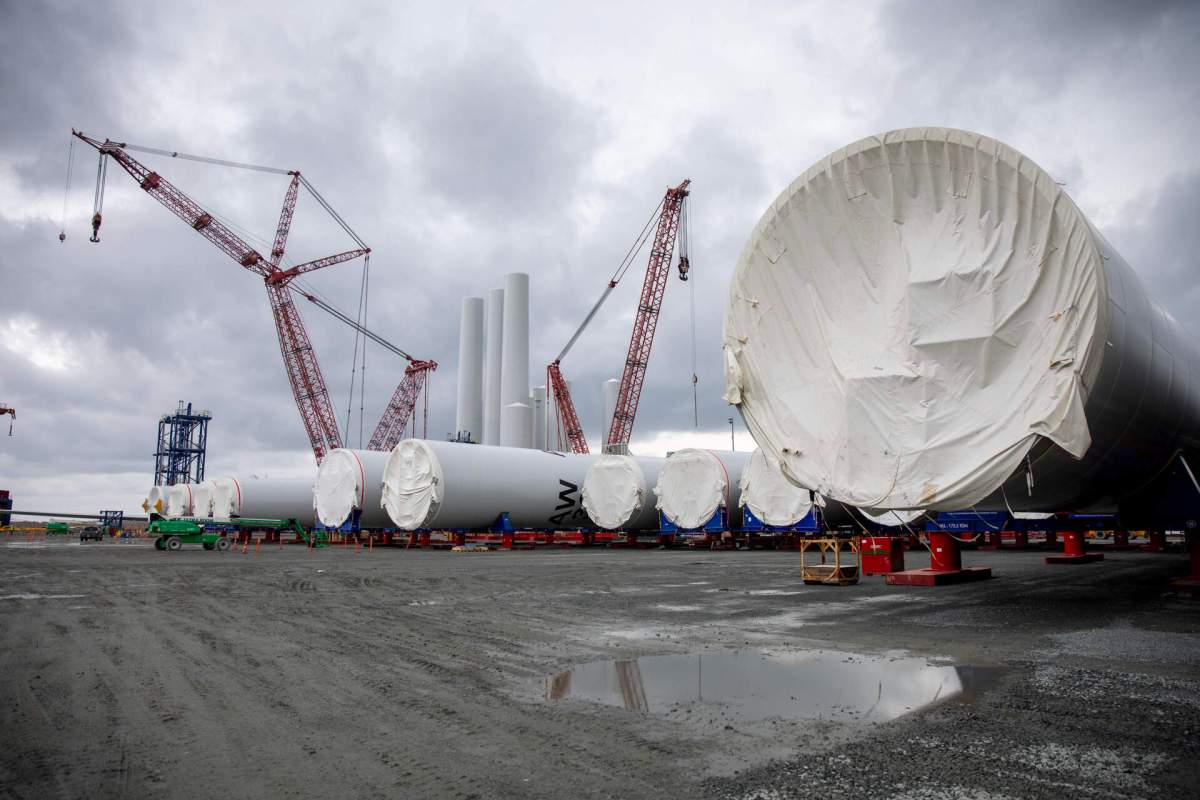 Sections of wind turbine towers sit on the dock at the New Bedford Marine Commerce Terminal.