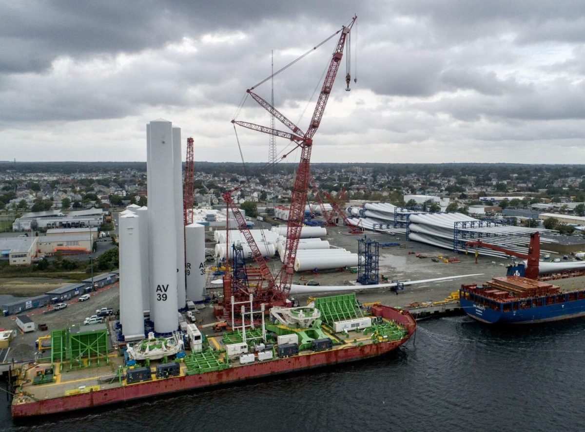 Ships docked at the New Bedford Marine Commerce Terminal load up turbine components.