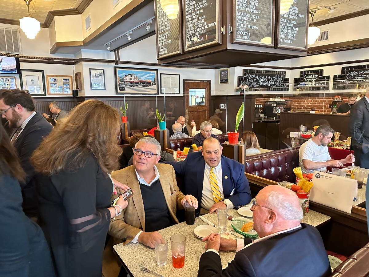 Men sit in a busy restaurant