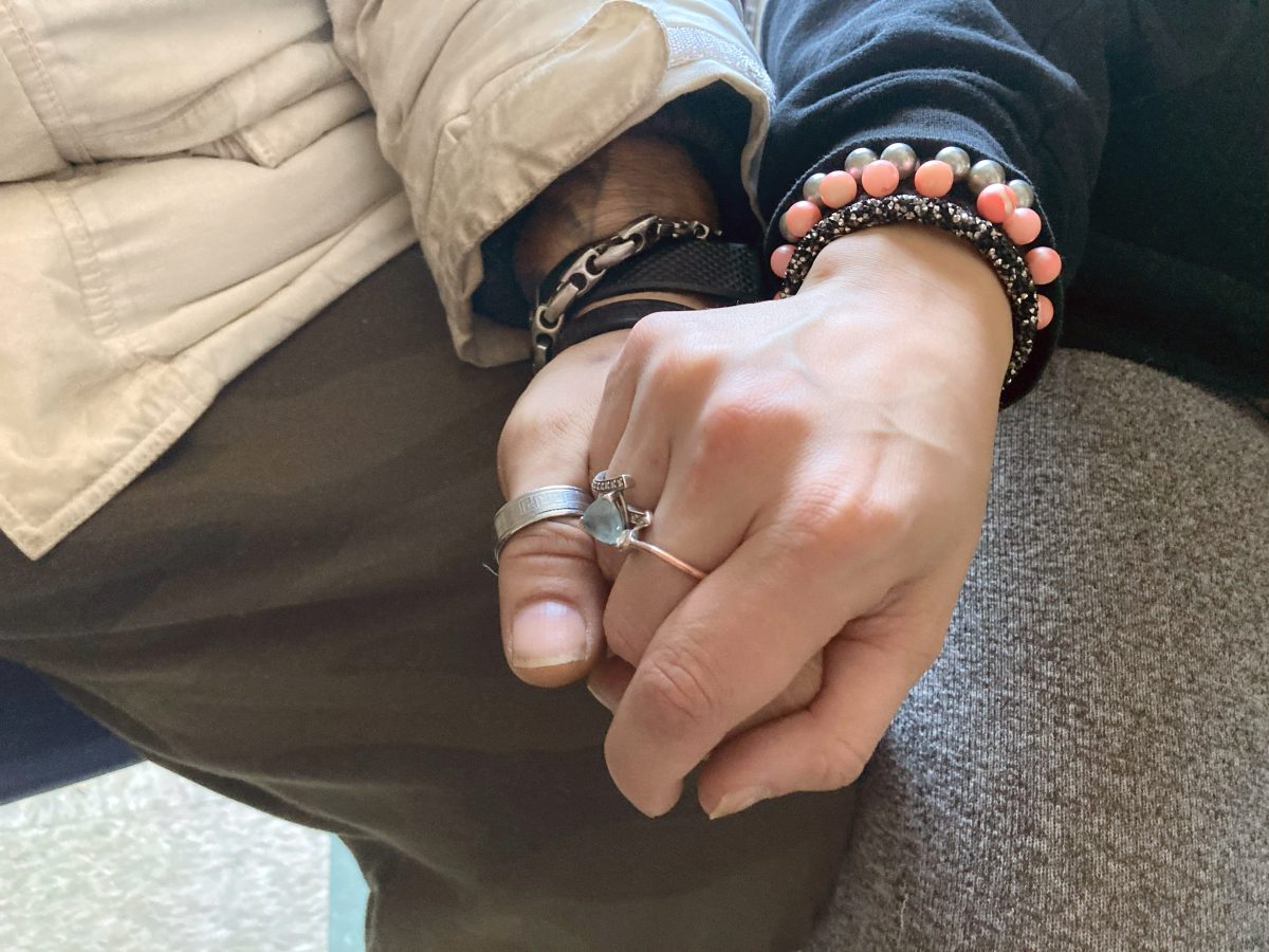 A photo of two clasped hands.