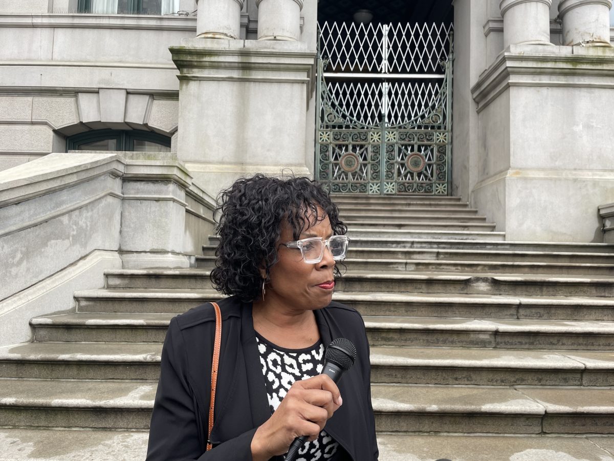 Kimberly Simmons, executive director of the Rhode Island Coalition to End Homelessness, spoke at a rally at City Hall on Wednesday, May 8.