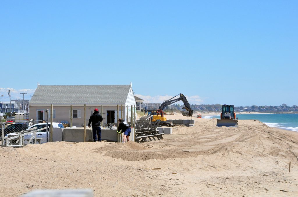 Crews work on the beach in front of the Jim’s Beach Misquamicut mobile home park on May 13, 2024.