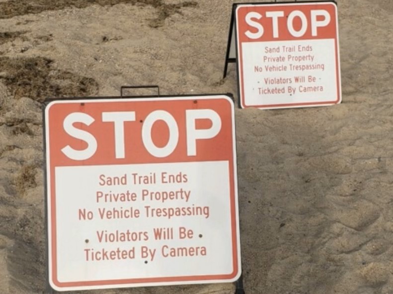 Signs warning of ticket penalties posted by Nope’s Island Conservation Association.