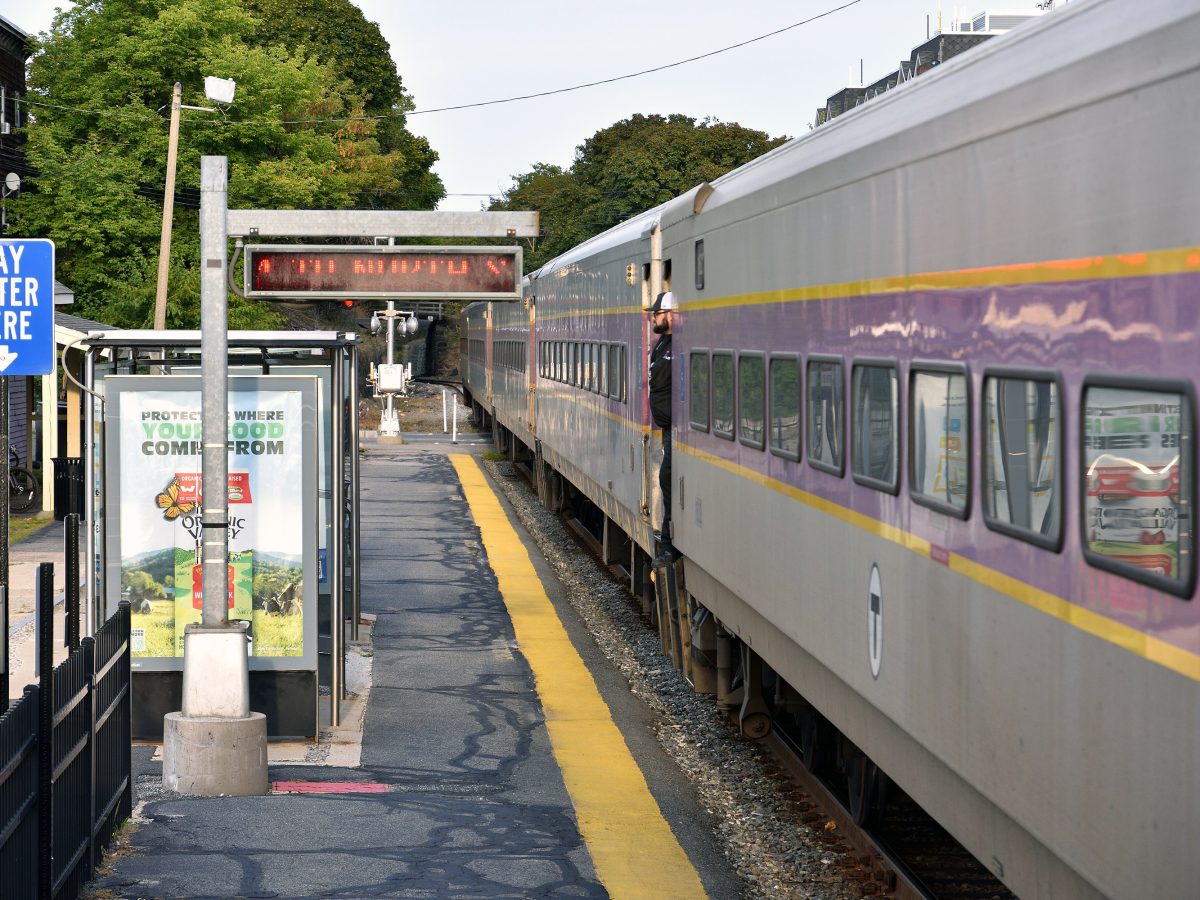 An MBTA commuter rail train waits on the inbound platform at the Waltham station in September 2023.